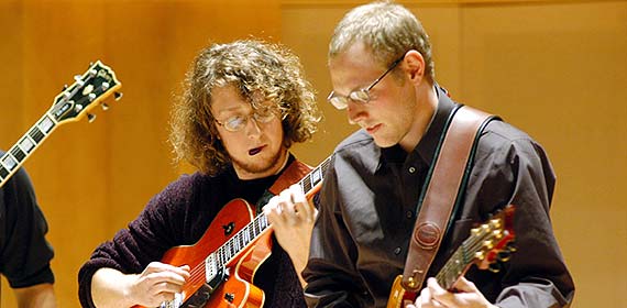 Guitarists playing in the Weber Music Hall.