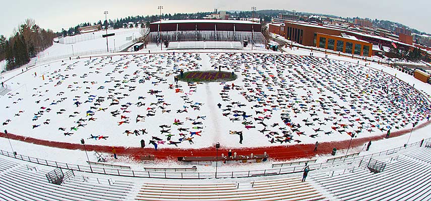 Almost 2,000 people made snow angel figures in the snow on UMD's Griggs Field as a fundraiser for those in Ethiopia affected by climate change.