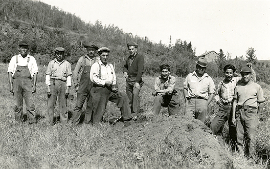 Indian Civilian Conservation Corps crew on stockade site at end of first day's work, Grand Portage, 1937.