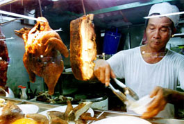 Lucky Chicken Rice food stall in the Newton Hawker Center, Singapore.