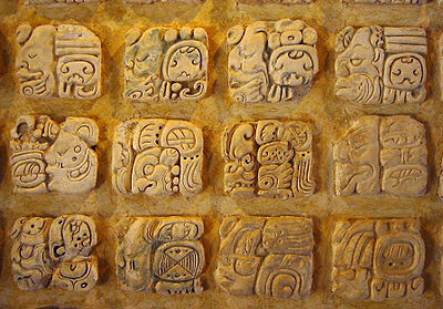 Maya glyphs in stucco at the Museo de sitio in Palenque, Mexico.