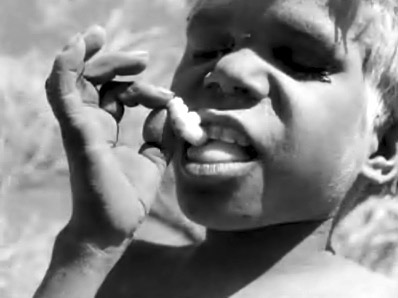 Desert People, boy eating "grub worm"