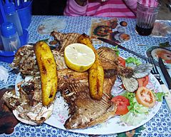 Plantains served over grilled pacu