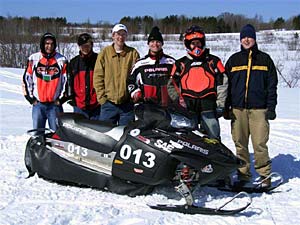 Students with snowmobile.
