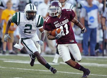 Bulldogs player running with ball.