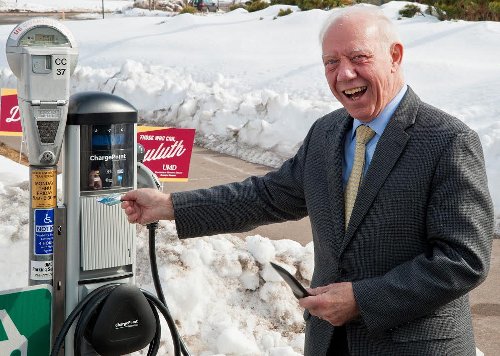 Congressman Jim Oberstar with a newly installed electric car charger at the University of Minnesota Duluth