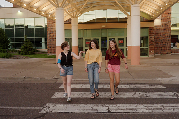 Students crossing the street at the Kirby bus hub.
