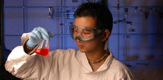 Student checks on his Chemistry experiment.