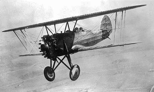 Fred Lund piloting plane, ca. 1920.