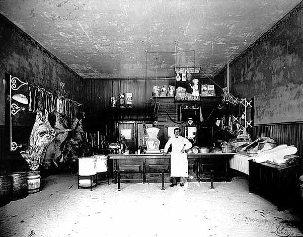 Interior of butcher shop, Dawson, ca. 1910.