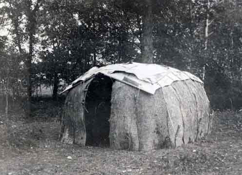 Wigwam covered with black ash and birch bark.