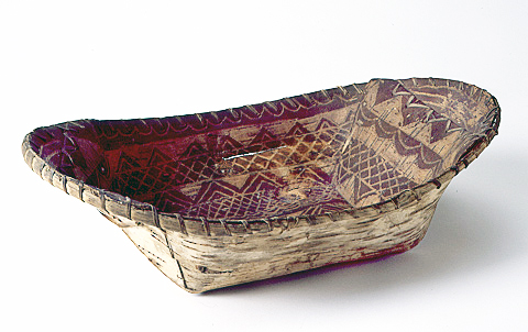 An Ojibwe oval birchbark winnowing basket or ricing tray, circa 1890. 