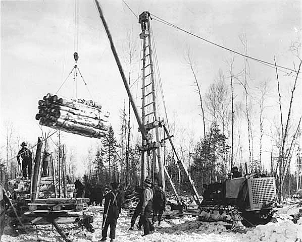 Logs decked and loaded with jammers, ca. 1930.