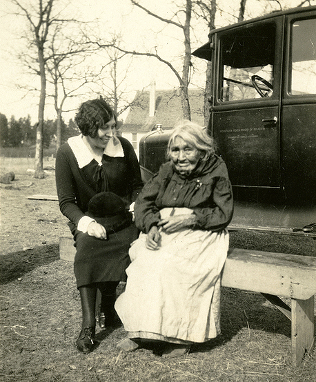 Elizabeth Sherer Russell, a public health nurse for Minnesota, with a patient, Mrs. Jones, ca. 1928.