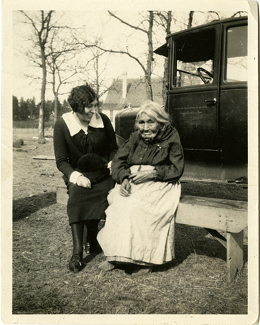 Elizabeth Sherer Russell, a public health nurse for Minnesota, with a patient, Mrs. Jones, ca. 1928.
