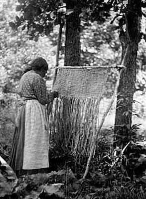 Woman weaving bull rush mats, ca. 1910