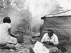 Mending sacks for wild rice, 1920