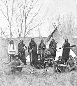 Sioux scouts in camp, with firearms, ca. 1885.