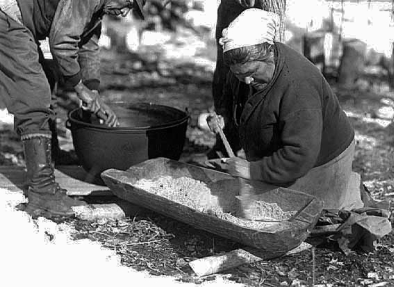 Fred and Mary Day making maple sugar, Mille Lacs, 1948.