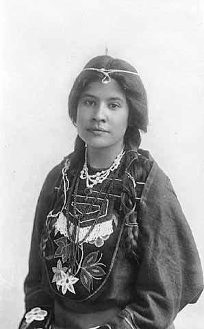 Margaret Guinon, office clerk at United States Agency, White Earth, dressed for celebration, 1910.