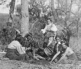Playing moccasin game, ca. 1880.