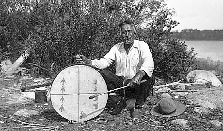 Indian councilor and his powwow drum, Lake of the Woods, ca. 1922.
