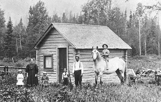 Aho family in front of their home in Karvenkyla, north of Chisholm, ca. 1905.