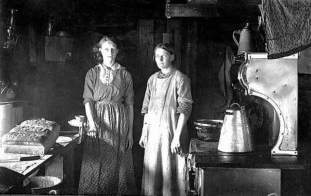 Women "cookees" (Carrie and Olga Stene) inside logging camp cookshack, John Masten Camp, Beltrami County, Ca. 1917.