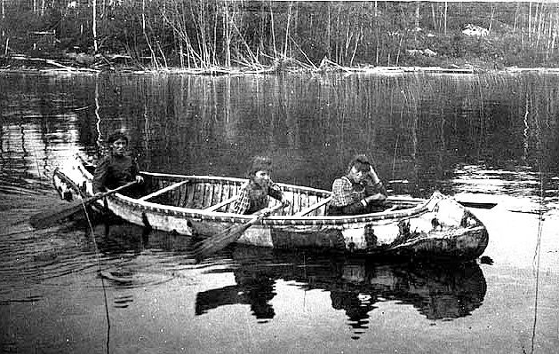 Chippewa woman and girls in birchbark canoe, Red Lake, 1898.