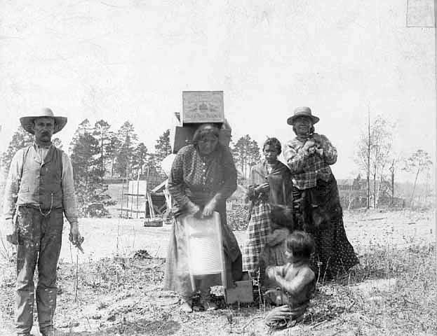 Ojibway women carrying groceries, Leech Lake Indian Reservation, 1896