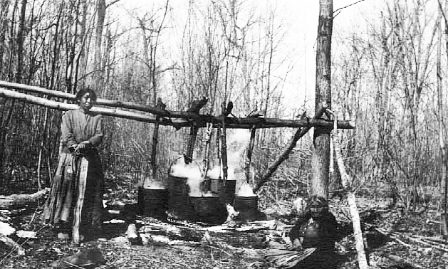 Indians making maple sugar, Cass Lake, ca. 1920.