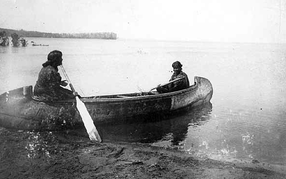 Ojibway women in canoe on Leech lake, 1896