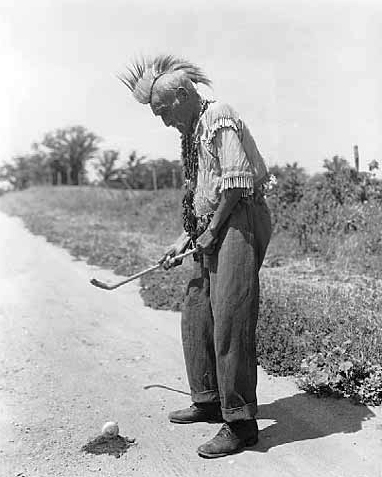 Man playing shinny, White Earth Reservation, 1936
