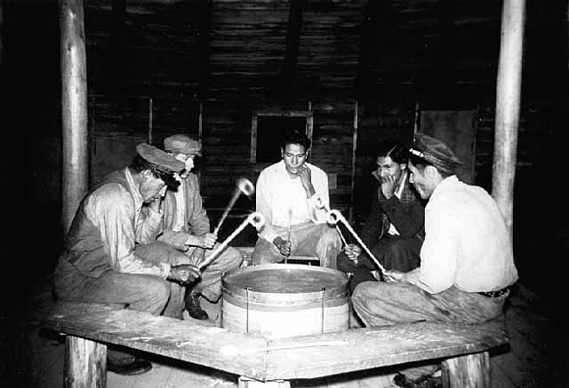 Drummer, Saturday night powwow, Nett Lake, 1937.