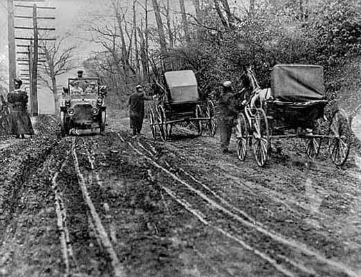 Walking horses past the auto, ca. 1905.