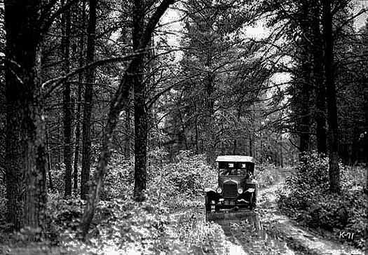 1924 Ford traveling on an early back road.