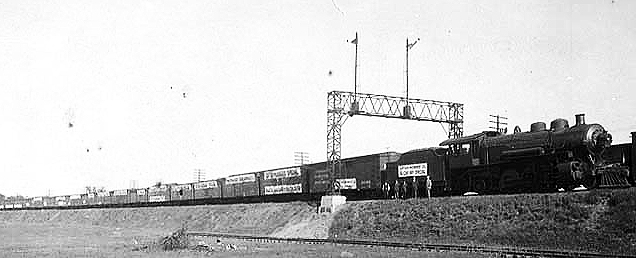 Loftus-Hubbard County fifty cars hay special train; Chicago, Milwaukee & Puget Sound Railroad, ca. 1915.