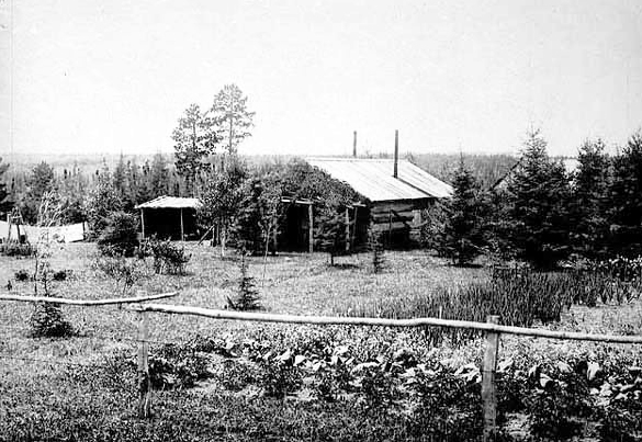 Log farmhouse, ca. 1910.