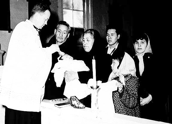 Baptism at Red Lake Indian Mission (St Mary's), Father Alban Fruth officiating, 1956.