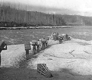 Indians packing goods, Canada, ca. 1895.