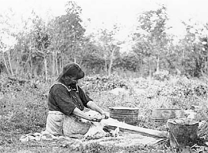 Onana fleshing a deer hide, Mille Lacs, 1925