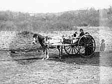 Indian woman and children in wagon, 1897