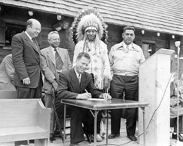R.F. Lee, Assistant Director, National Park Services; Don Foster, Area Director, Bureau of Indian Affairs; Dale Doty, Assistant Secretary of the Interior; Ed Wilson, Chief of Chippewas; and John Flatt, Chief of Grand Portage Band at Grand Portage national historic site dedication, 1951.