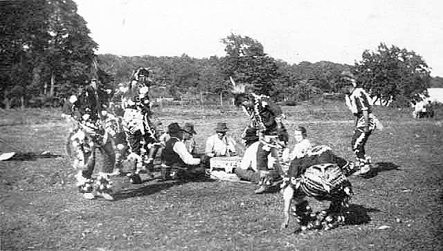 Indian singers and dancers at powwow, Mille Lacs Reservation, ca. 1920.