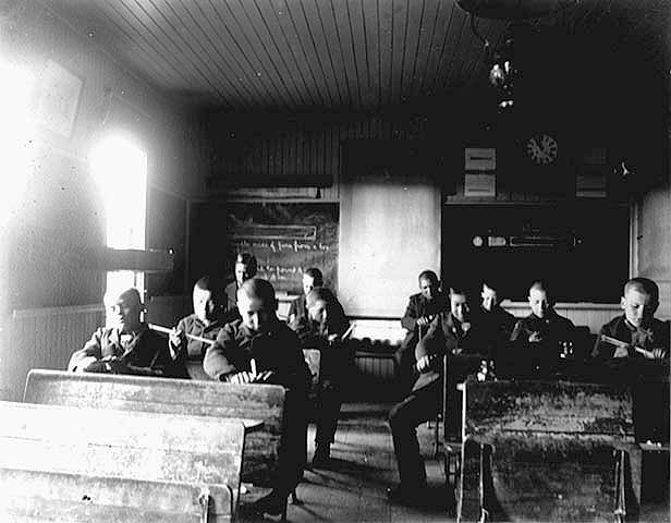 Classroom in an Indian boarding school, location unknown, ca. 1900.