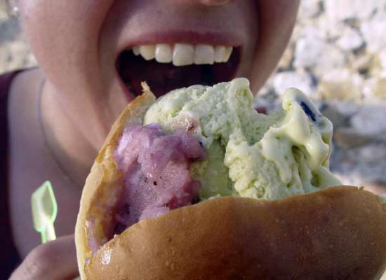 Sicilian ice-cream in a bread bun. A good solution to a local problem: the Mediterranean heat quickly melts the ice-cream, which is absorbed by the bread.