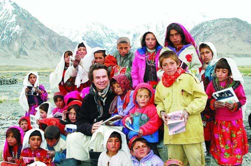 Greg Mortenson is shown in 2005 with students from Sitara School in the Sarhad Village in the Wakhan corridor in Northeastern Afghanistan. It's the first school in one of the most remote ares of Afghanistan, where the litercay rate was less than five percent