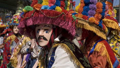 Toro Huaco dancers in costume at Fiesta de San Sebastian.