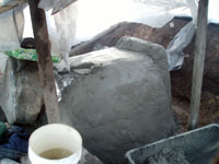 Plaster coat on outside of oven.