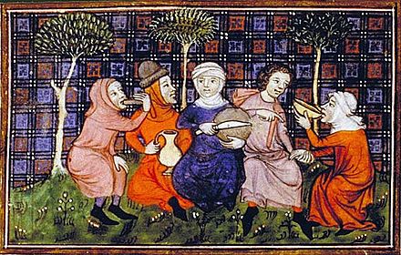 A group of travelers sharing a simple meal of bread and drink; Livre du roi Modus et de la reine Ratio, 14th century.